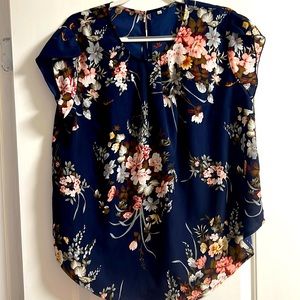 Navy blue floral, short sleeve shirt.